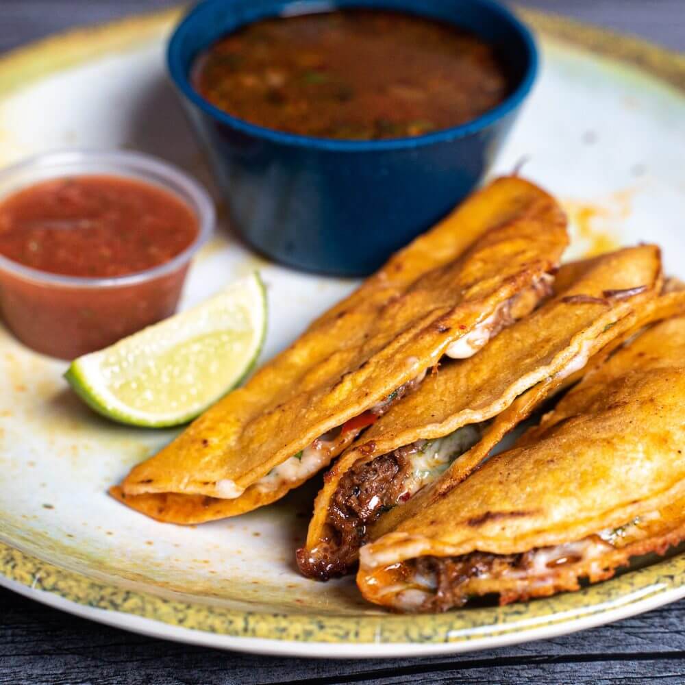 Abuelita's signature dishes Quesabirria TacosRamen BirriaPlatillo Grande